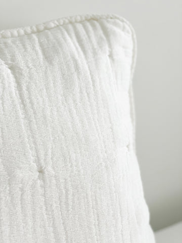 Close-up of a pillow from the Easy Cotton Gauze Quilt & Pillow Set, featuring soft and breathable cotton fabric in white.
