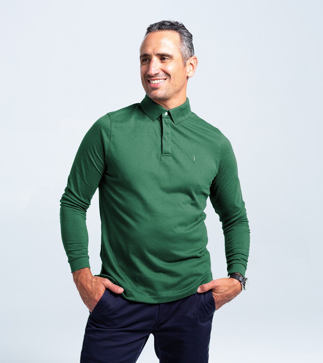 Man wearing green Long Sleeve Perfect Polo with hidden microfiber cloth and StaySharp Collar, perfect for cooler weather and style.