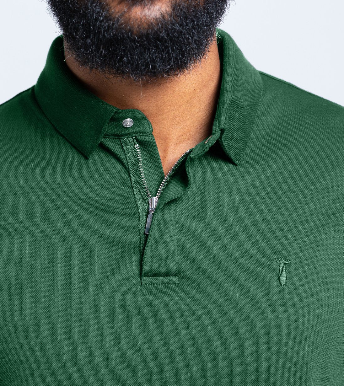 Man wearing green Long Sleeve Perfect Polo with StaySharp™ Collar and hidden snaps for crisp look.