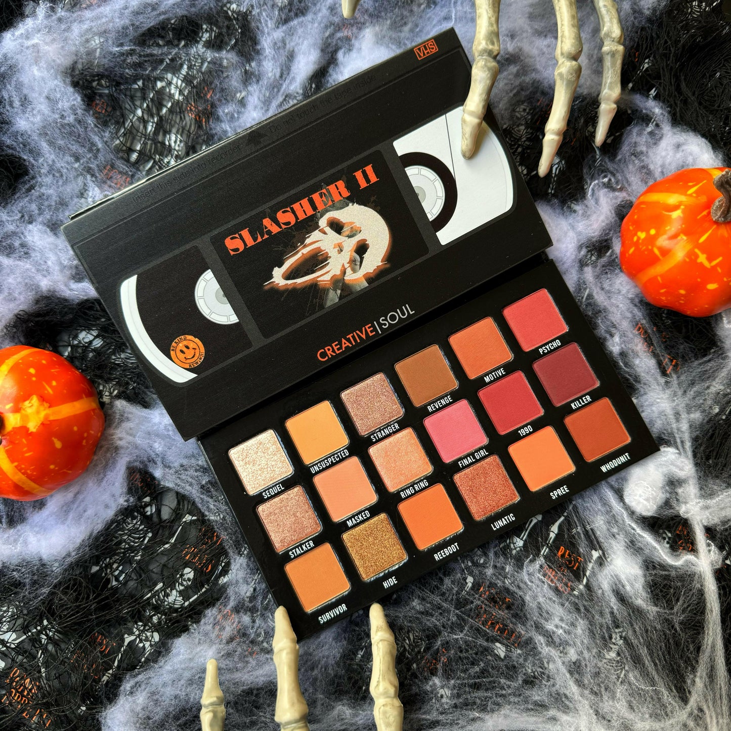 Slasher II Eyeshadow Palette with horror-themed packaging, featuring neutral shades, perfect for spooky makeup and 90s horror movie fans.