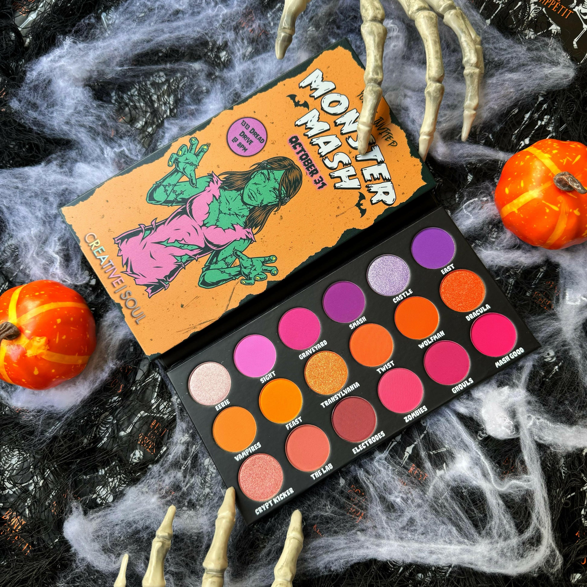 Monster Mash Eyeshadow Palette with 18 vibrant Halloween-themed shades including pink, orange, purple, and lavender.