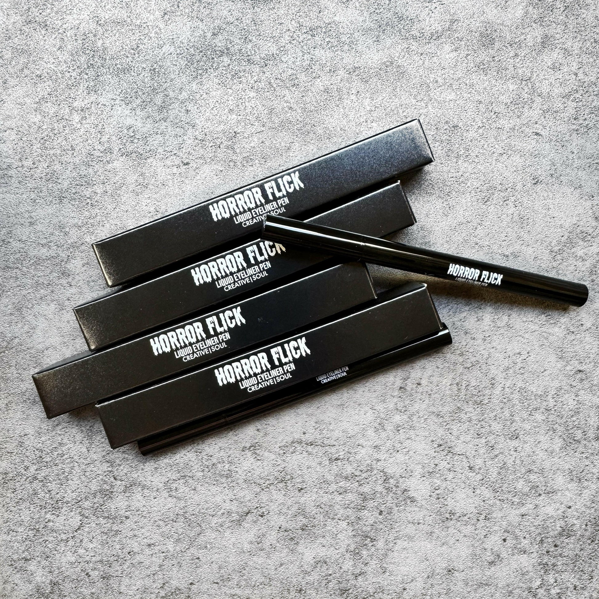 Crypt Horror Flick Liquid Eyeliner Pen with precision tip for smooth, long-lasting application in deep brown shade, waterproof and smudge-proof.
