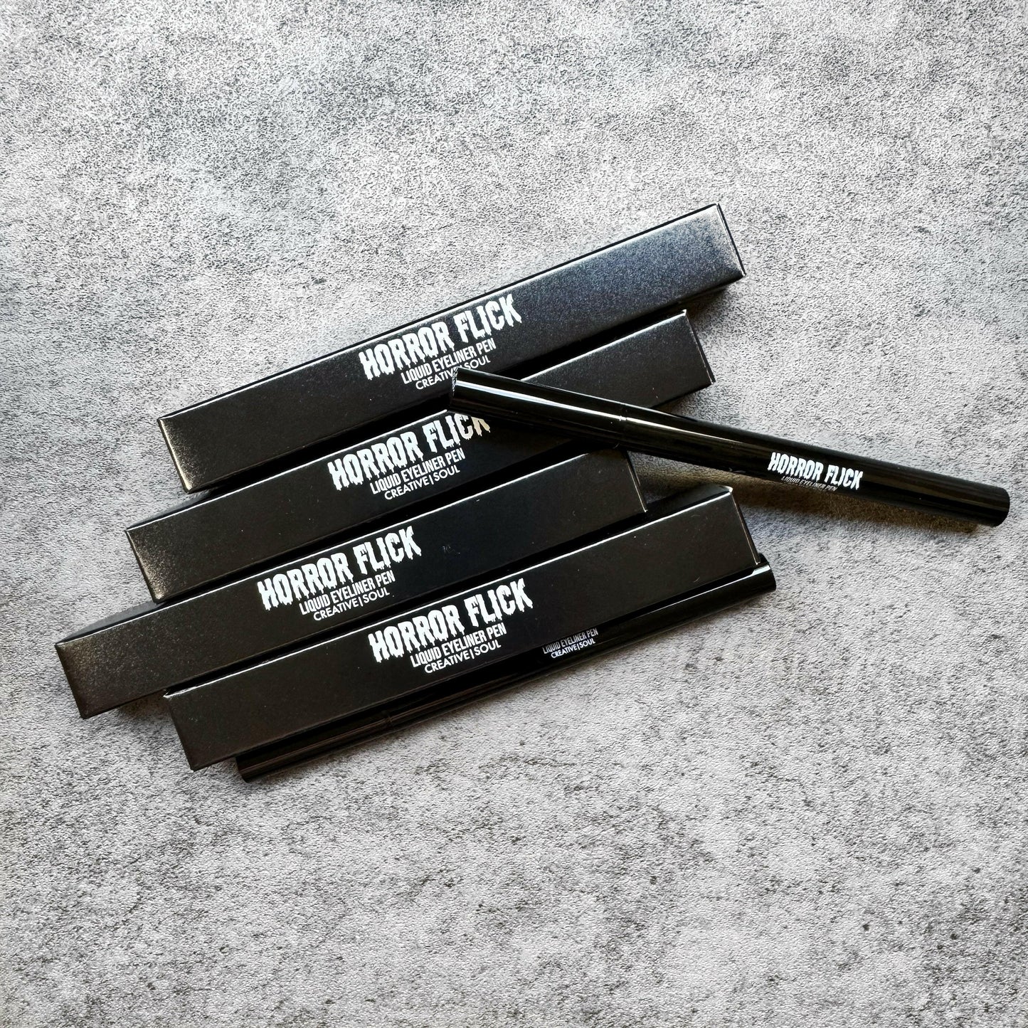 Horror Flick Liquid Eyeliner Pen in Serpent, emerald green shade with precise brush tip for long-lasting, smudge-proof application.