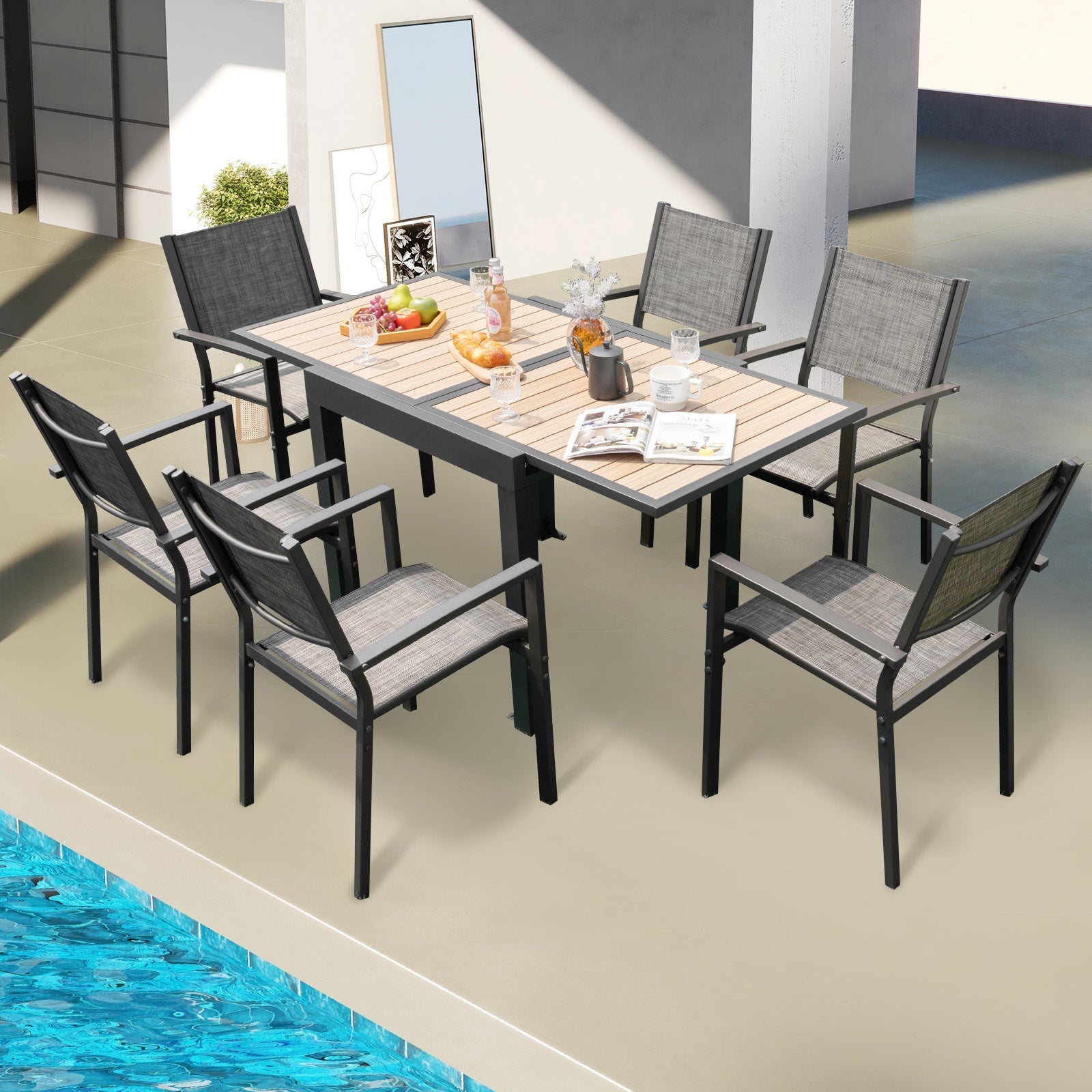 31.5-63 Inches Extendable Patio Table for 4-6 People-Natural in a modern outdoor setting by the pool.