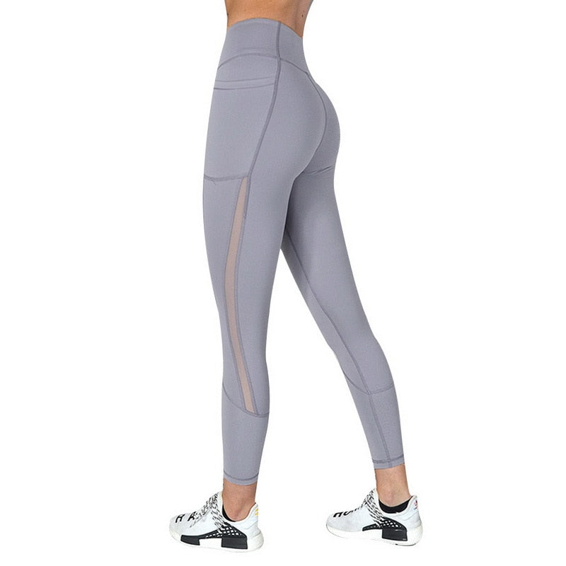 Yoga Leggings with Phone Pocket featuring spliced pattern and breathable mesh details, perfect for workouts.
