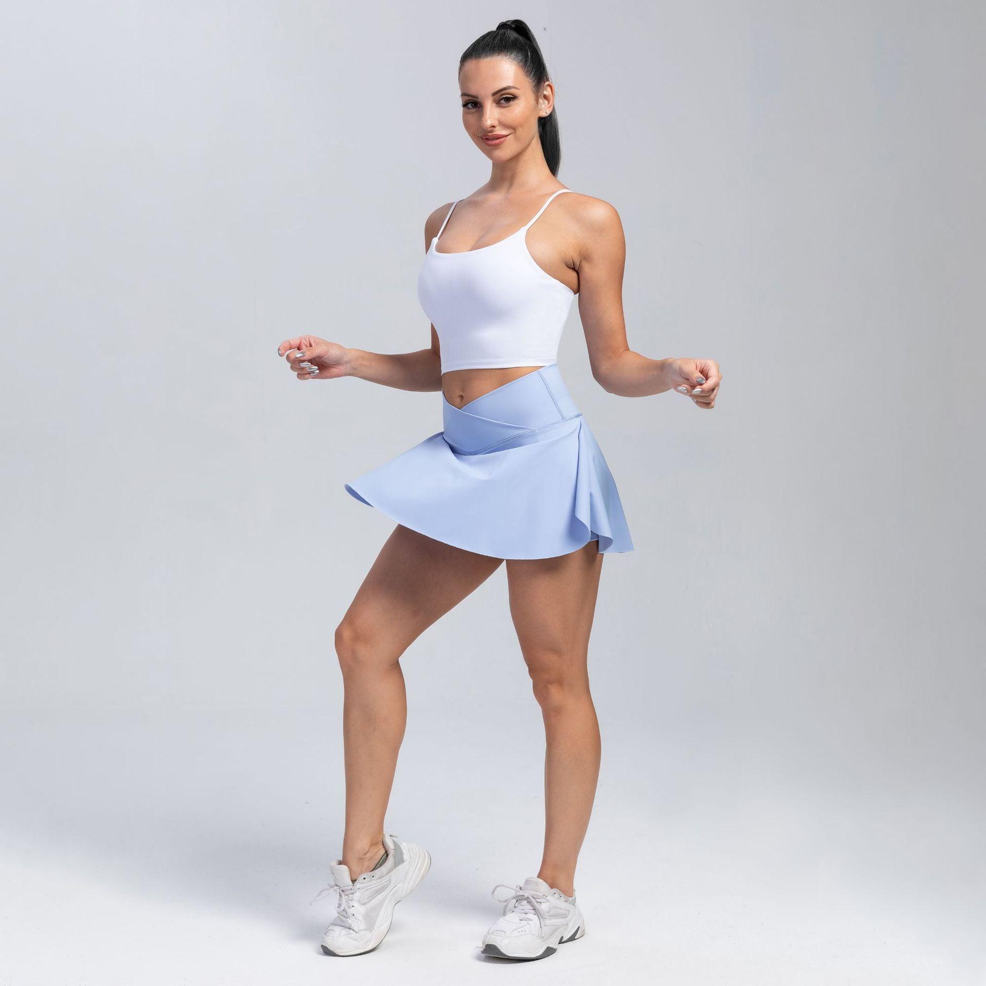 Woman wearing Cowgirl Fit High-Waisted Yoga Skirt Shorts, sporty and stylish activewear with a high waist and skirt overlay.