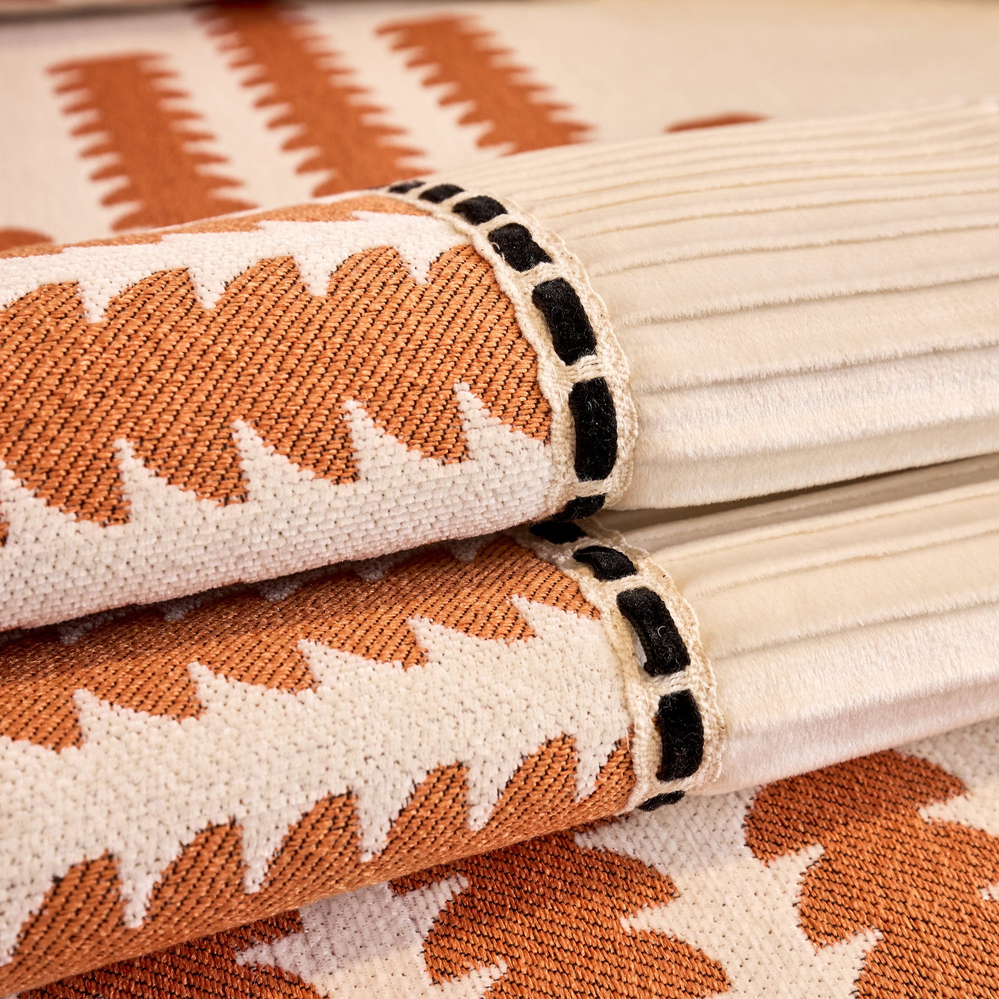 Close-up of Vertical Stripes Sectional Sofa Cover Slipcover, featuring geometric pattern in chenille fabric with silicone grips.