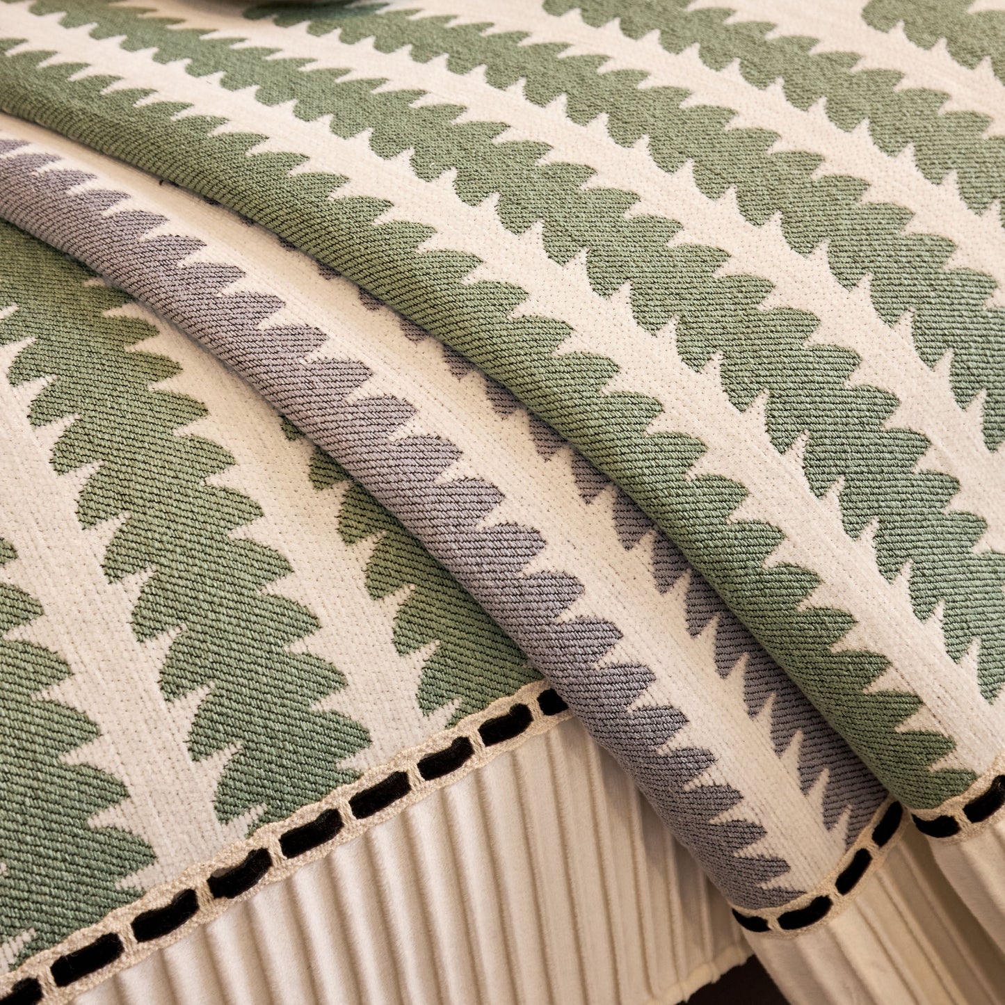Close-up of green and beige striped fabric with woven texture.