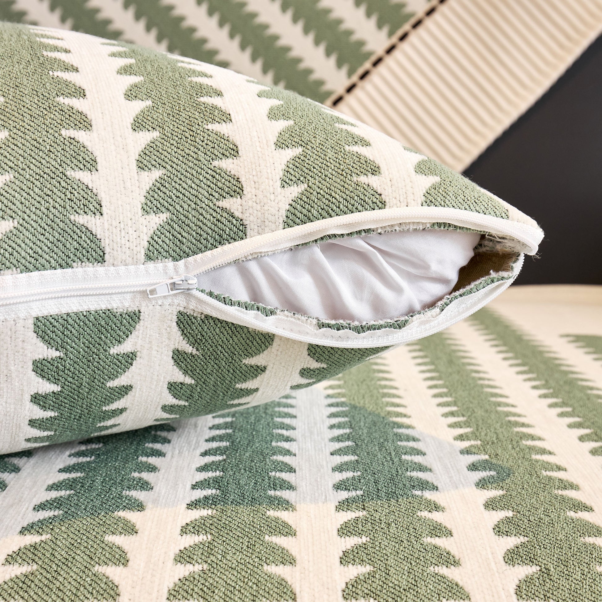 Close-up of Vertical Stripes Sectional Sofa Cover Slipcover showcasing zipper detail and textured chenille fabric with non-slip backing.
