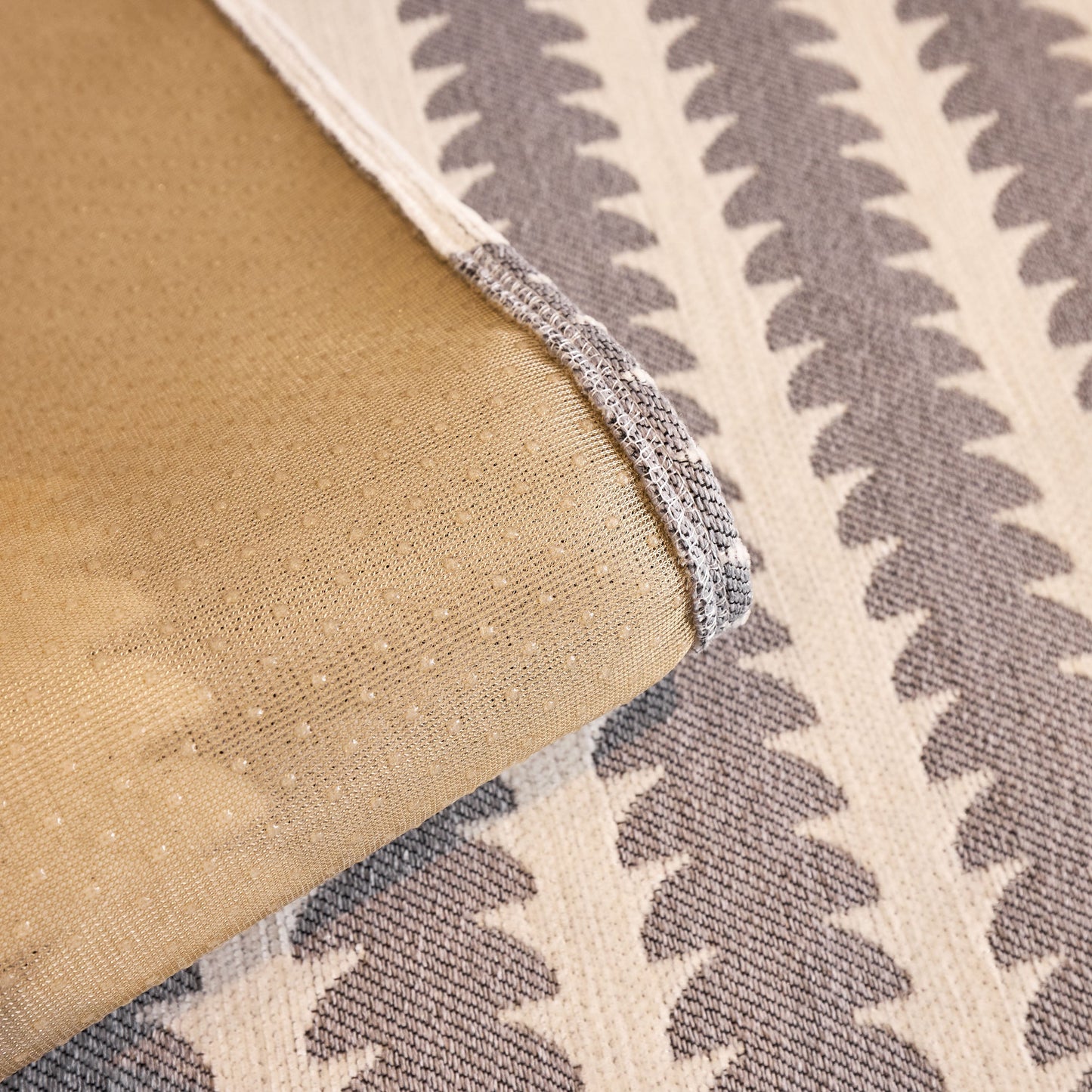 Close-up of Vertical Stripes Sectional Sofa Cover Slipcover - Non-Slip, Fits L-Shape Couches showing geometric pattern and textured fabric.