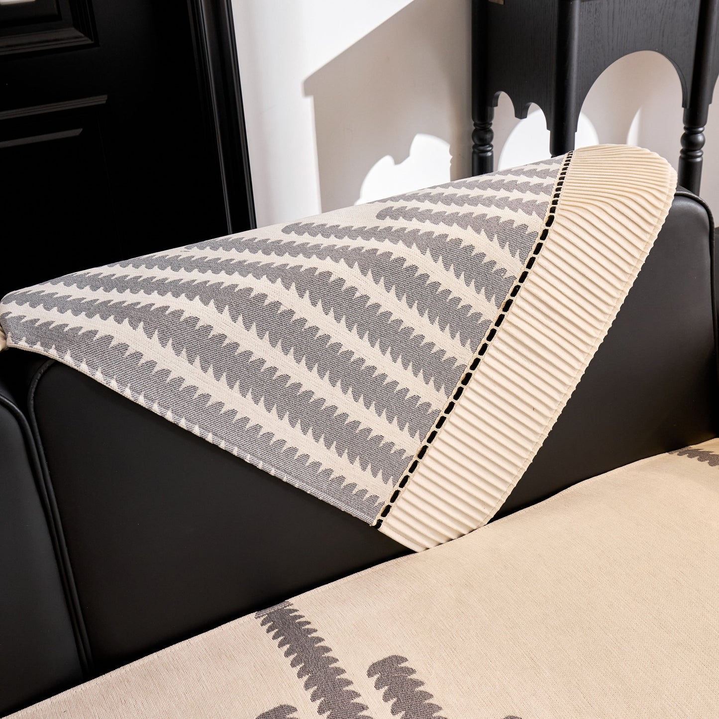 Vertical Stripes Sectional Sofa Cover Slipcover - Non-Slip, Fits L-Shape Couches in modern geometric pattern on a black sofa.
