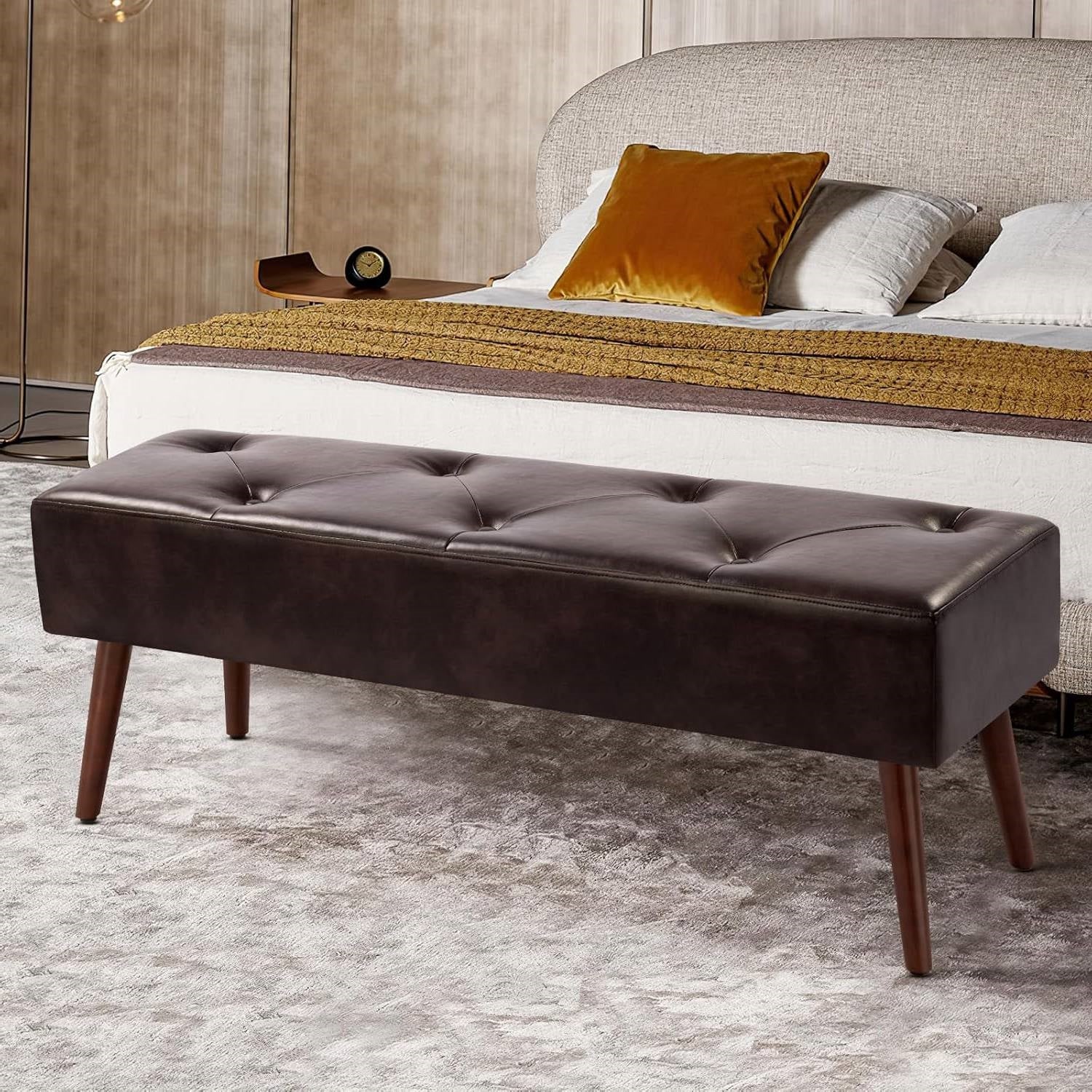Mid-Century Bed Bench with Dark Brown Leather Upholstered Seat Solid Wood Legs in bedroom setting, high-quality leather offering comfort.