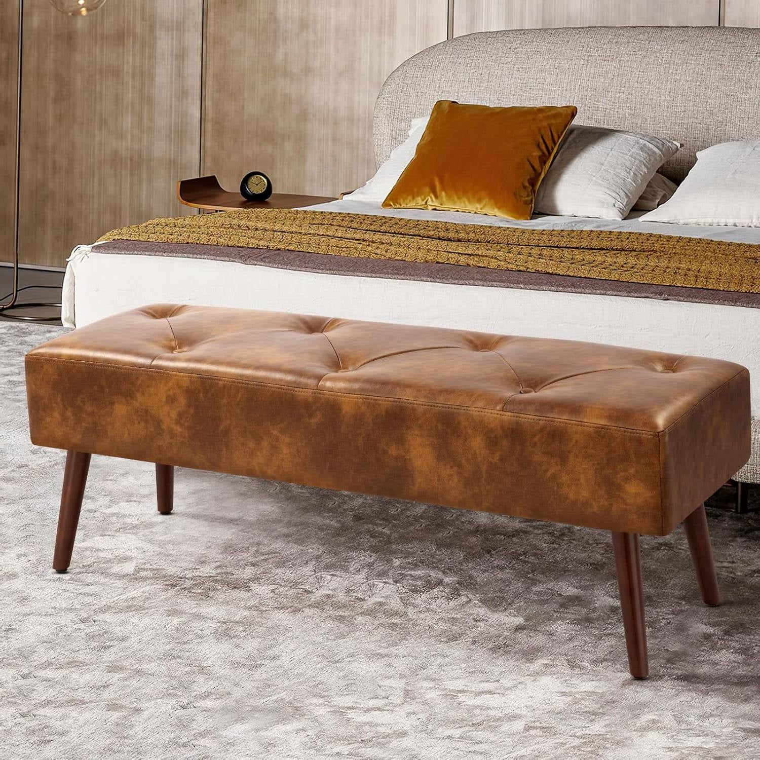 Mid-Century End of Bed Bench with Brown Leather Upholstered Seat Solid Wood Legs in a stylish bedroom setting