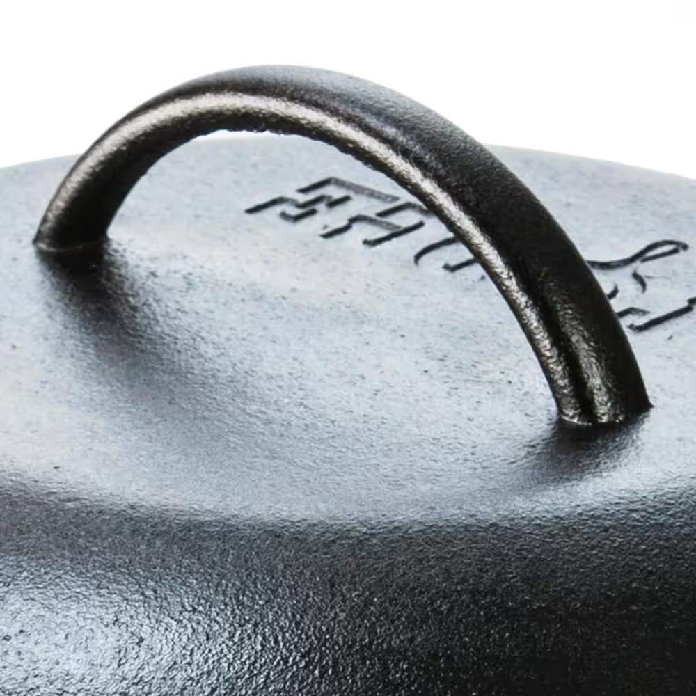 Close-up of the handle on a 5-Quart Black Cast Iron Dutch Oven with Lid for Oven Stove Grill or Campfire.
