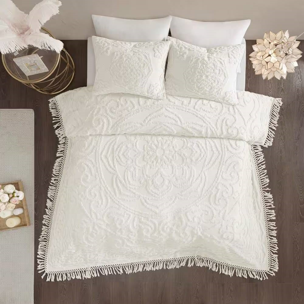 Full/Queen 100-Percent Cotton Chenille Bedspread with Fringe Hem in Off-White on a bed with decorative pillows and a stylish fringe.