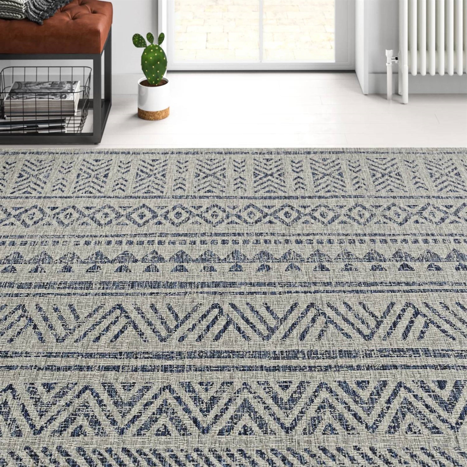 4 ft. x 6 ft. Blue Grey Chevron Coastal Boho Style Indoor Outdoor Area Rug with geometric patterns on white floor