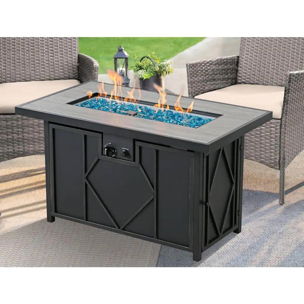 42-inch Outdoor Propane Gas Fire Pit Patio Table with Blue Fire Glass providing warmth on a patio.