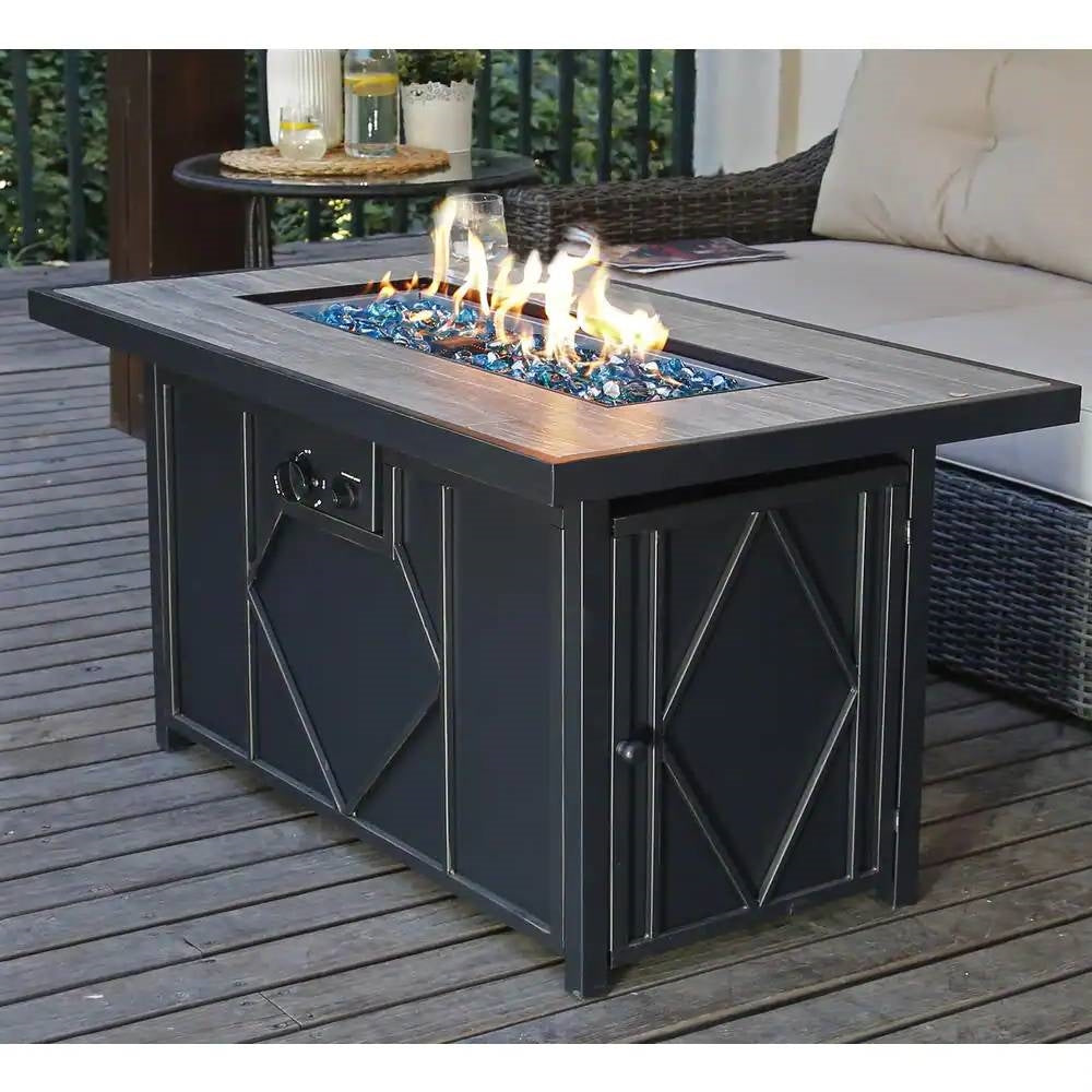 42-inch Outdoor Propane Gas Fire Pit Patio Table with Blue Fire Glass on a wooden deck