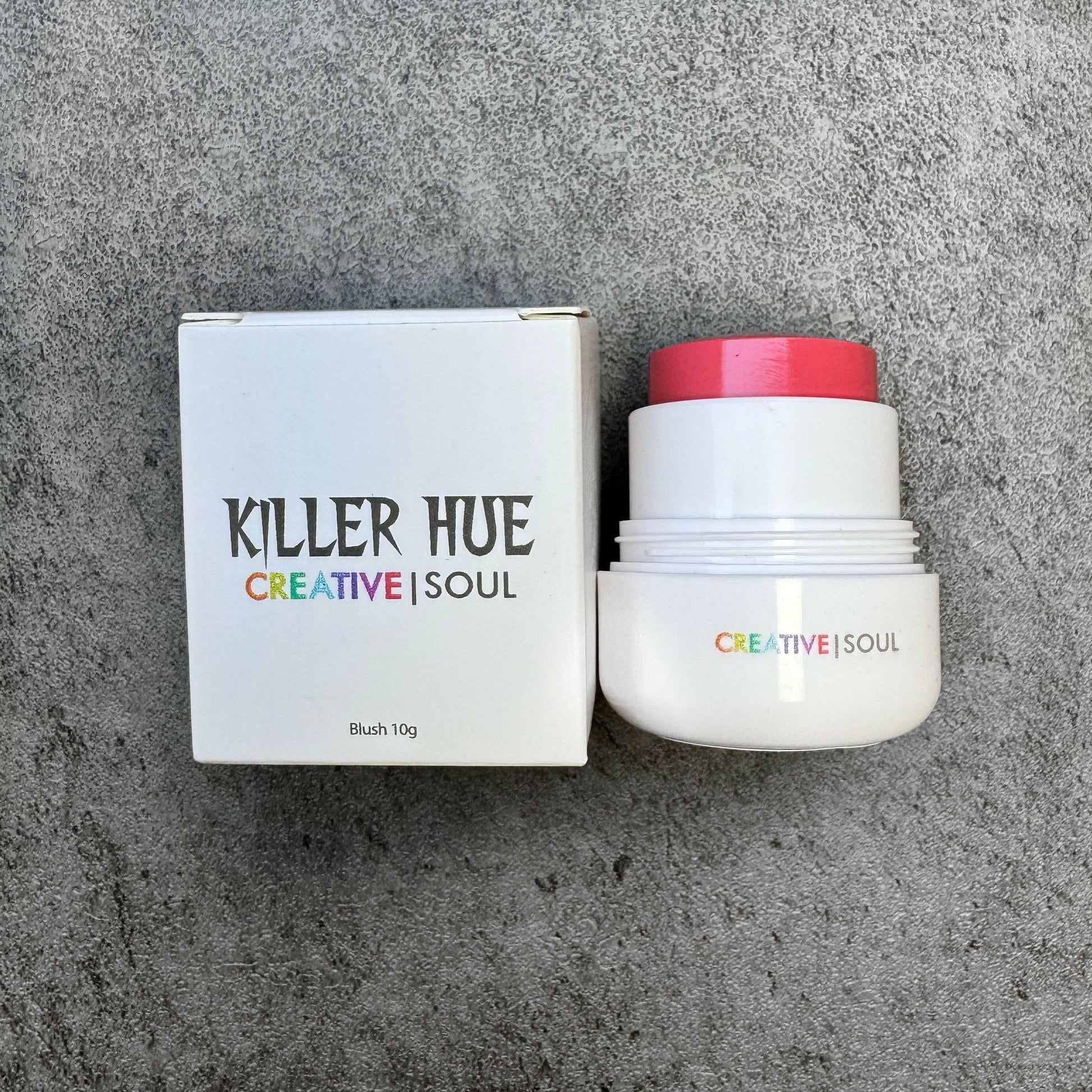 Killer Hue cream blush in shade Manic Mauve, cruelty-free and vegan, shown in packaging with smooth satin-matte finish.