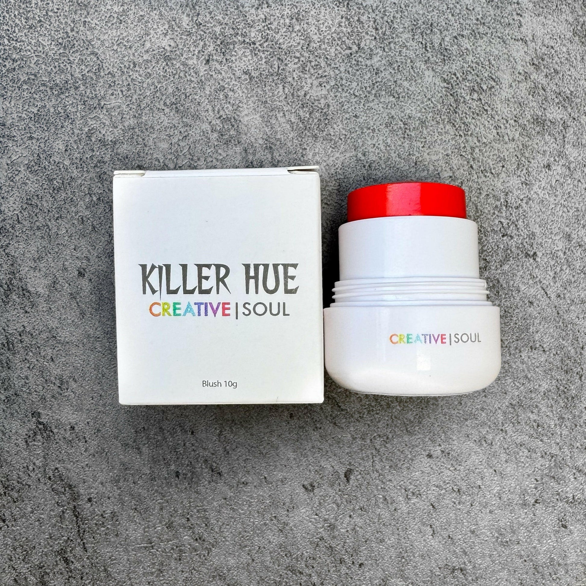 Creepy Crimson cream blush by Killer Hue in deep red, vegan, cruelty-free, smooth satin-matte finish for all skin types.
