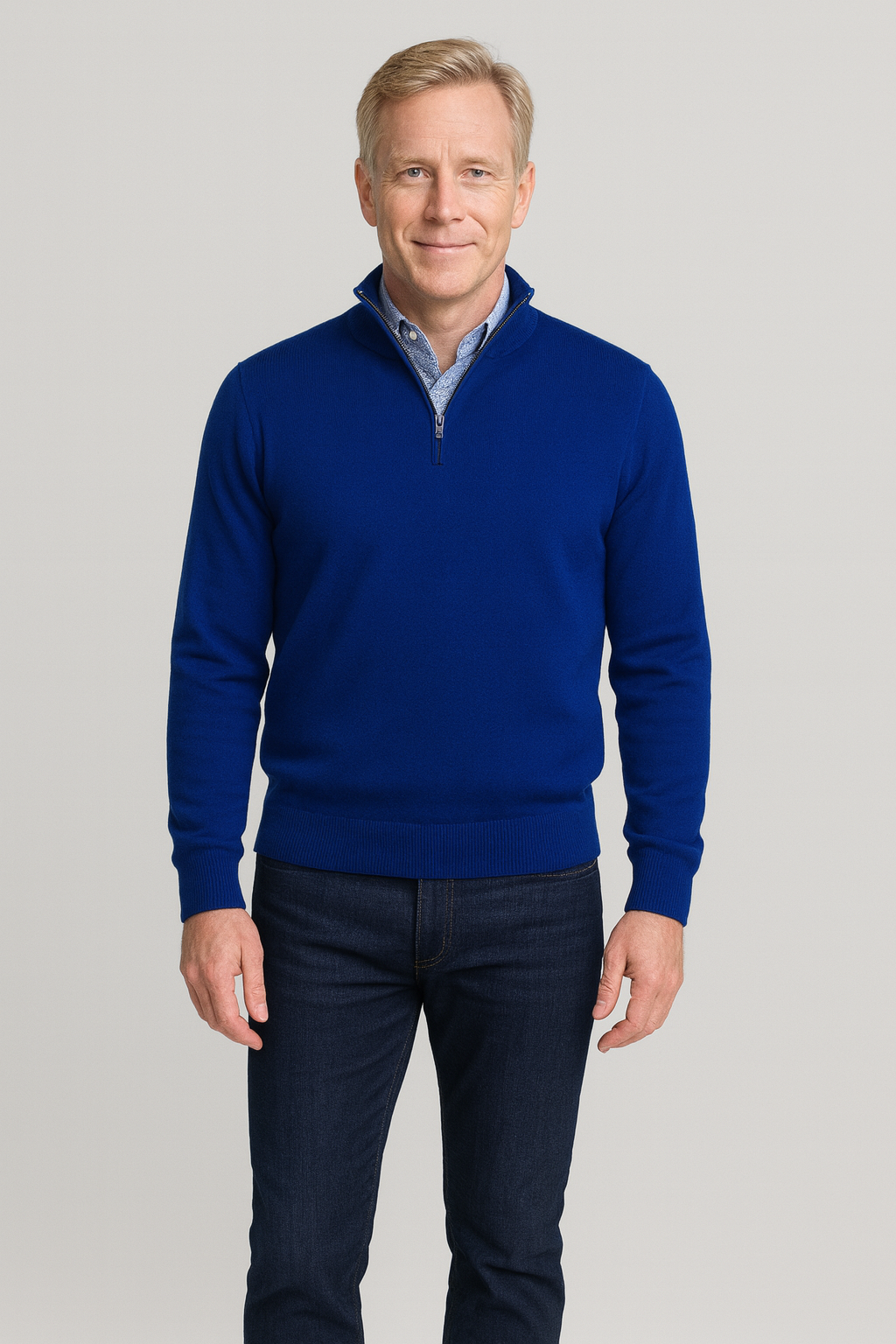 Man wearing Merino Wool Quarter-Zip Sweater in Admiral Blue with ribbed cuffs and sleek zip-up collar. Ideal for layering.