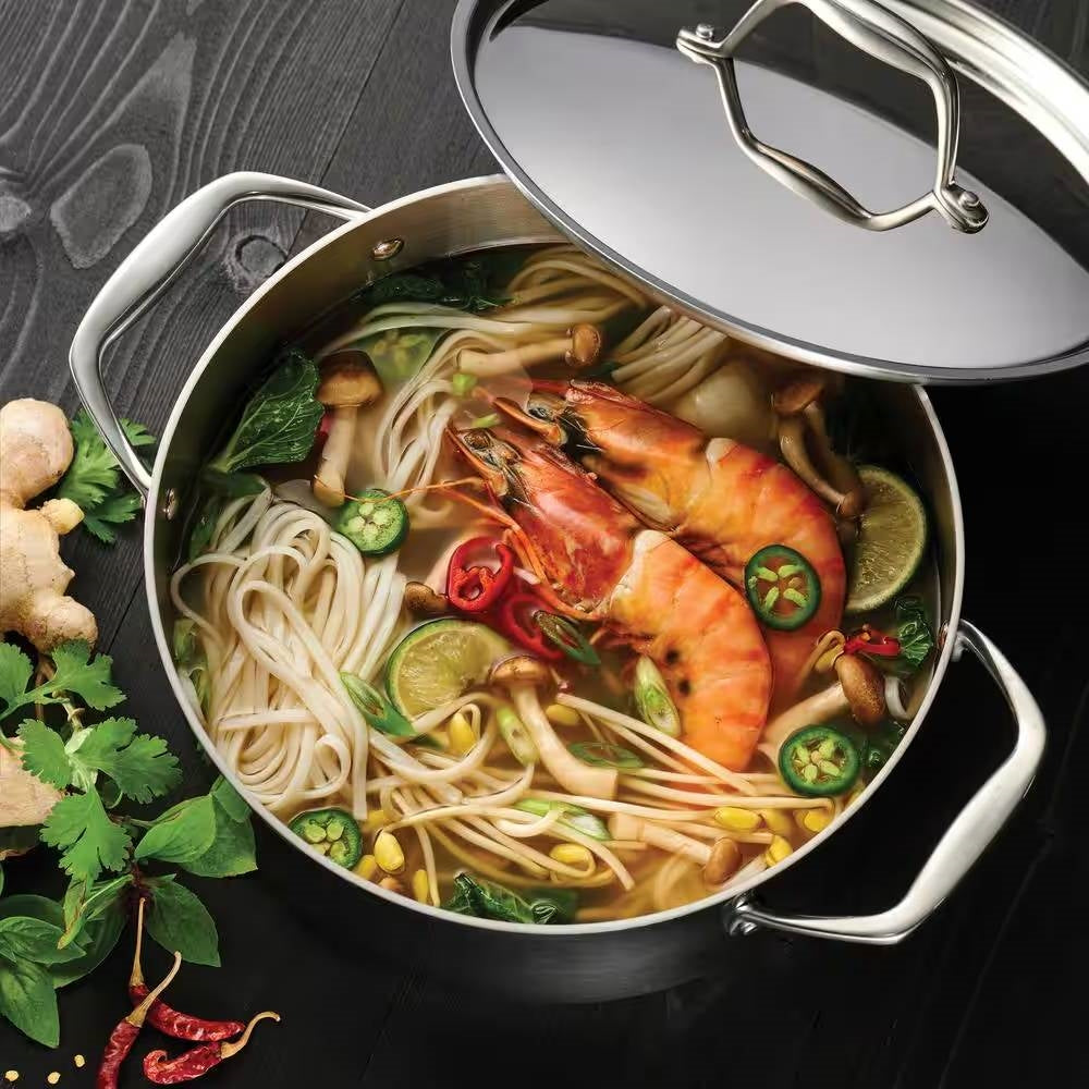Stainless Steel Tri-Ply Clad 5-Quart Dutch Oven with Lid filled with delicious shrimp noodle soup and fresh ingredients