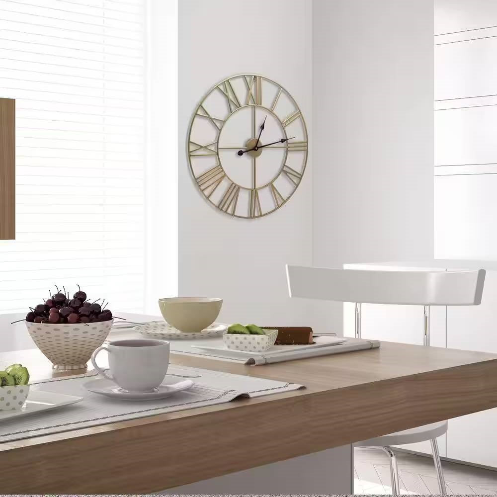 Round 24-inch Decorative Gold Metal Wall Clock Roman Numerals and Black Hands on a kitchen wall