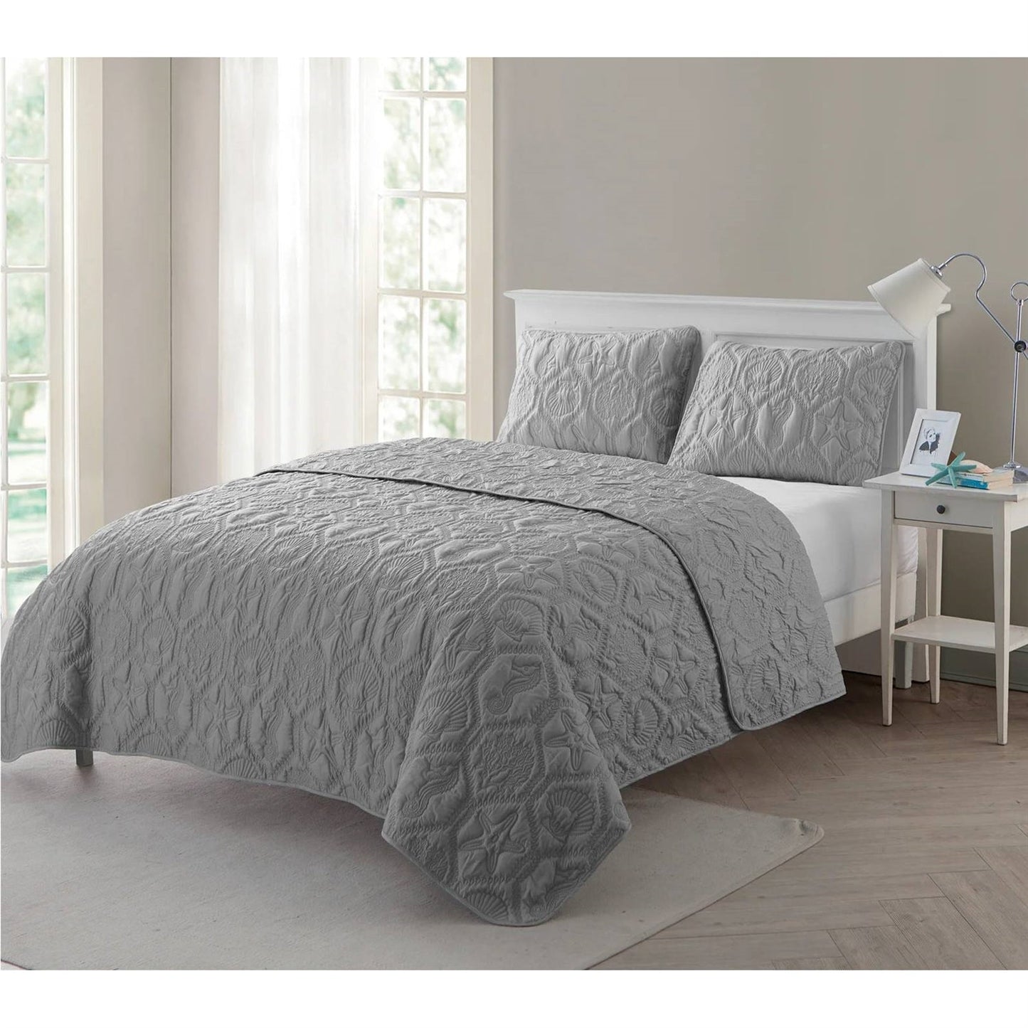 King Coastal Beach Embossed Starfish Seashell Seahorse Grey 3-Piece Quilt Set displayed on a bed in a bright room