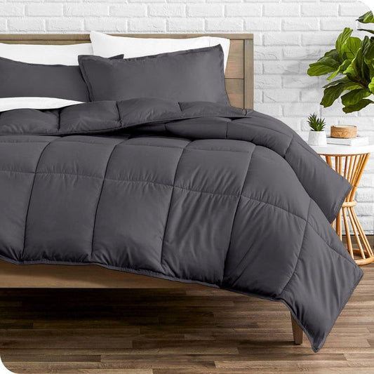 Twin/Twin XL Size All Season Super Soft Down Alternative Comforter Set Grey on a bed in a stylish room.