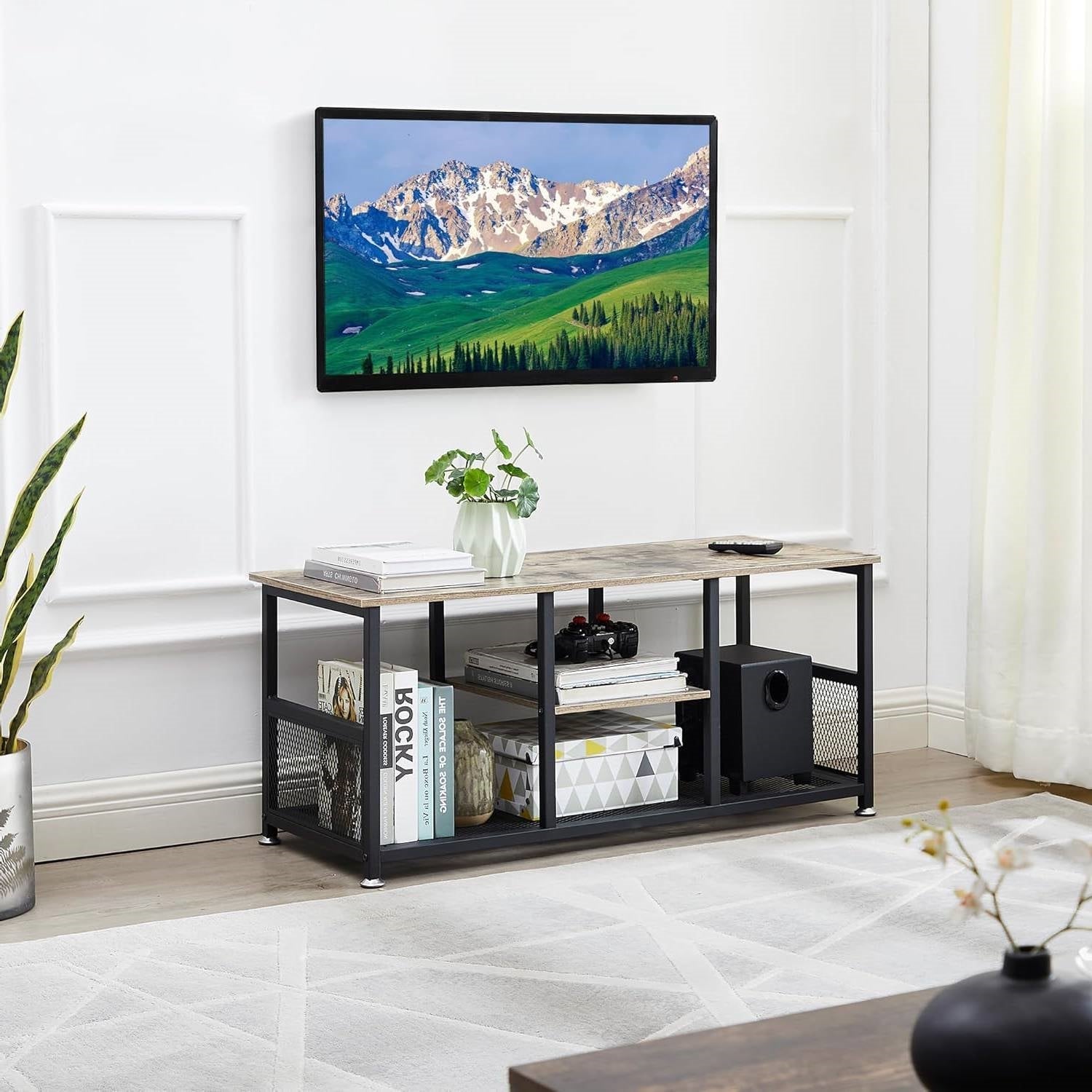 Industrial Modern Black Metal Grey Wood TV Stand with Media Storage Shelf in a living room setting