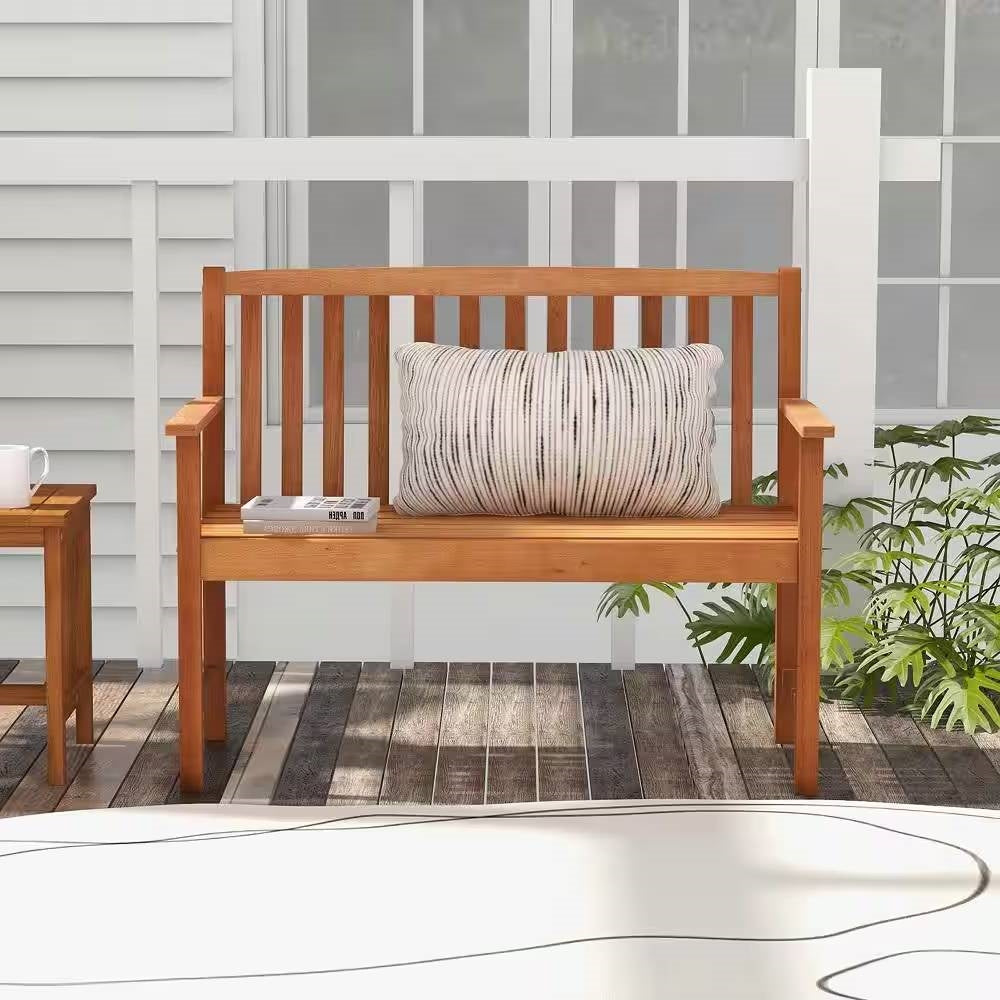 Solid Wood 4-Ft. Outdoor Patio Garden Bench - 800 lbs. Weight Capacity on a porch with cushion and plants