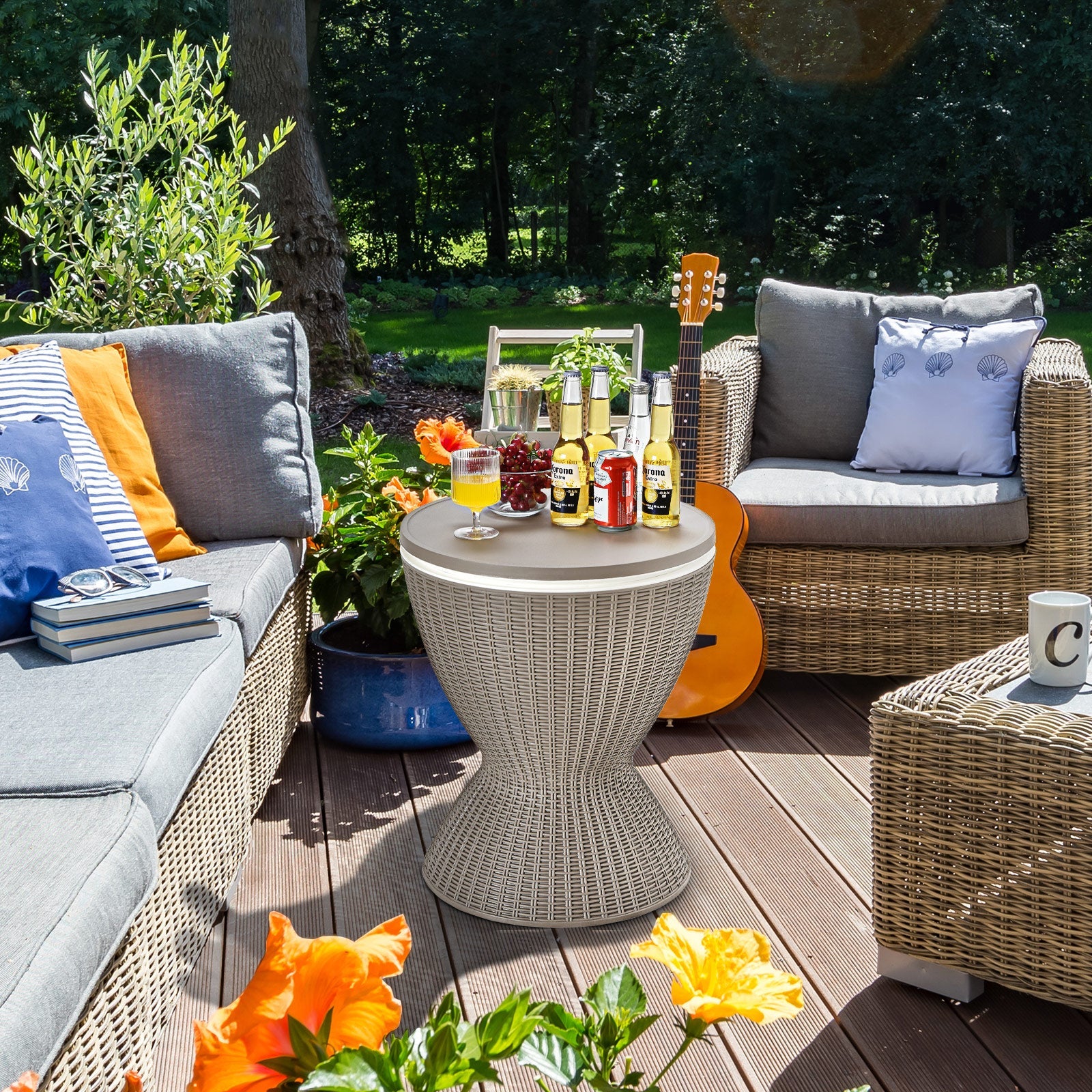 3 in 1 8 Gallon Patio Rattan Cooler Bar Table with Adjust Ice Bucket-Brown on a sunlit deck with drinks and snacks