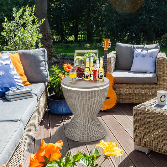 3 in 1 8 Gallon Patio Rattan Cooler Bar Table with Adjust Ice Bucket-Brown on a sunlit deck with drinks and snacks