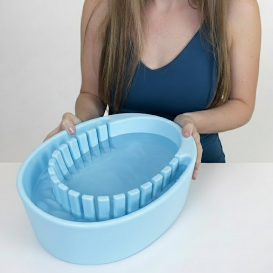 Woman holding the Arauris Pure - Facial Cold Plunge Bowl with Ice Chamber, showcasing its unique design for skin and mood benefits.