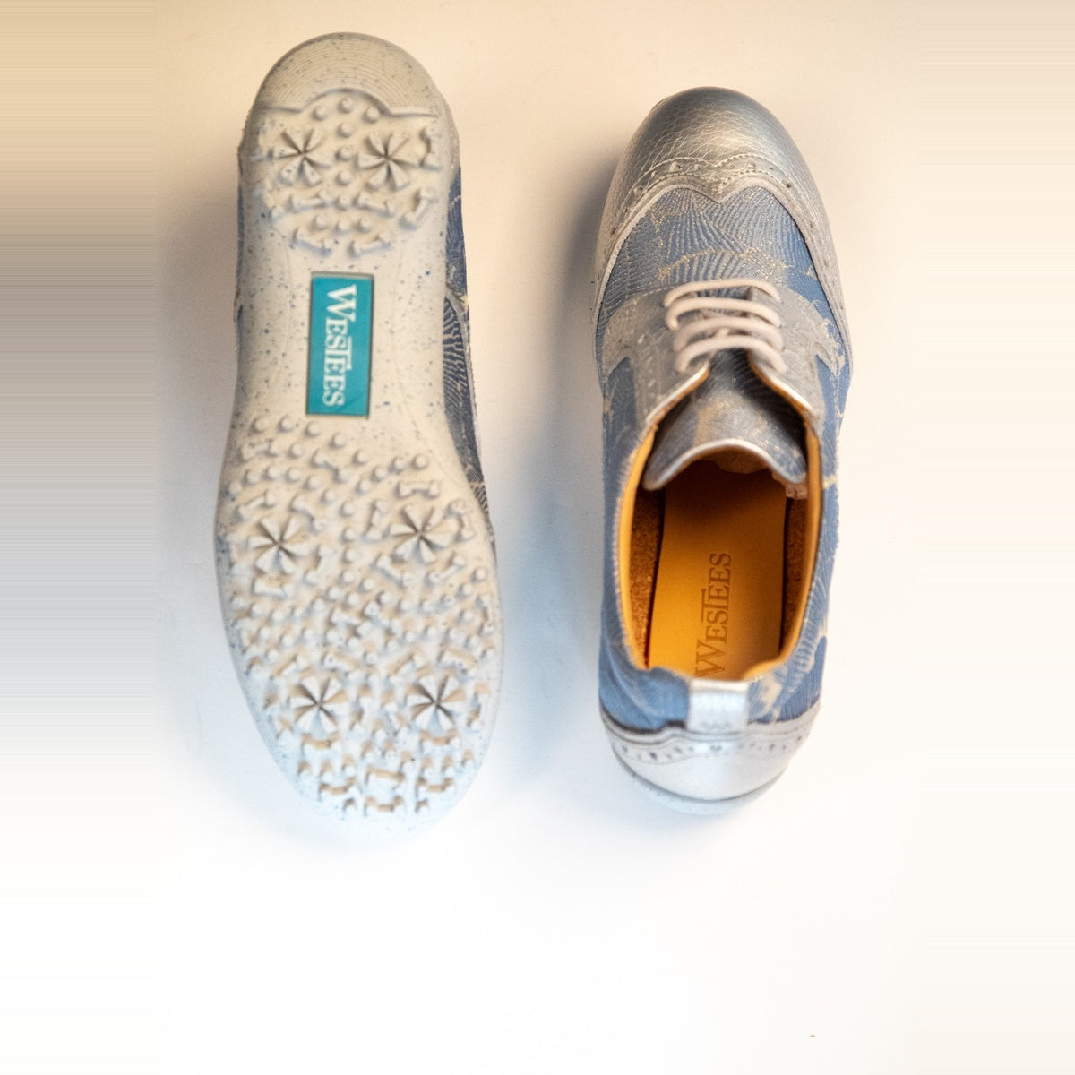 WesTees Grace golf shoes with blue and silver abstract print, cork insole, and durable sole.
