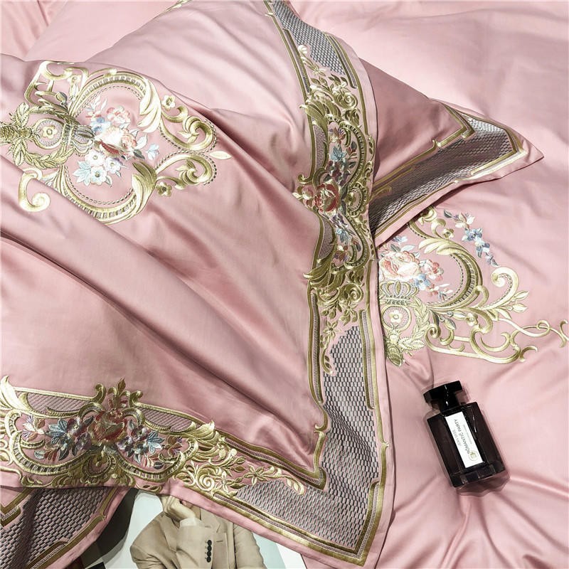 Louis Duvet Cover Set (Egyptian Cotton 1000TC) in pink with royal pattern, displayed with a perfume bottle and glossy magazine page.