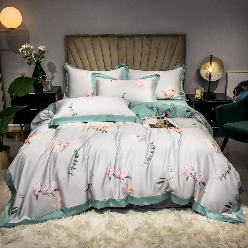 Luxurious Pink Rose Duvet Cover Set (Egyptian Cotton) with floral pattern on a neatly made bed in a stylish bedroom.