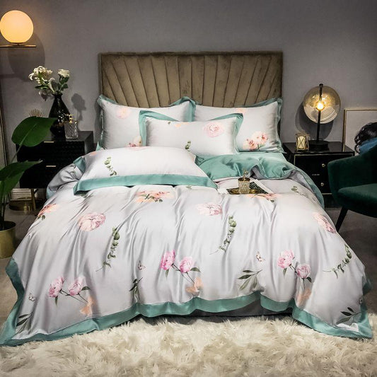 Luxurious Pink Rose Duvet Cover Set (Egyptian Cotton) with floral pattern on a neatly made bed in a stylish bedroom.