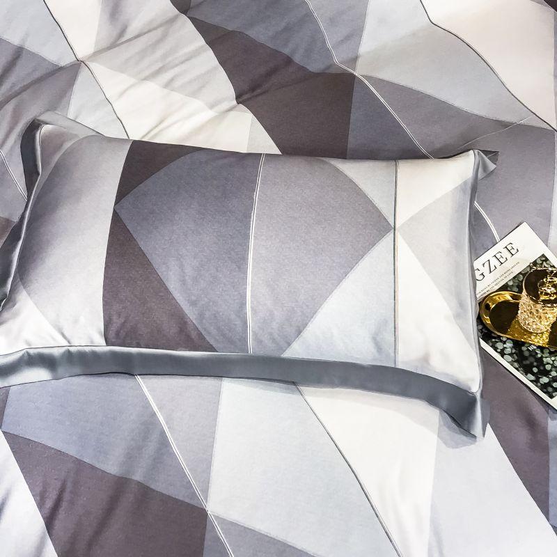 Purple Diamonds Duvet Cover Set (Eucalyptus Lyocell) in elegant diamond pattern on a bed with coordinating pillowcase.