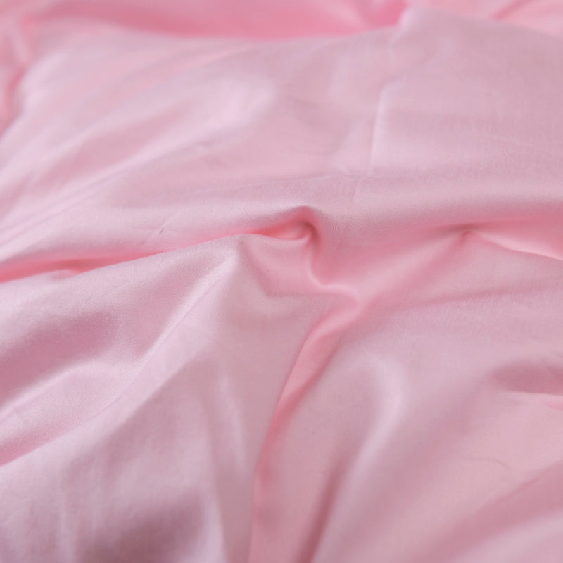 Close-up of pink Giuseppina 1000 Thread Count Goose Down Comforter Duvet in soft Egyptian cotton.