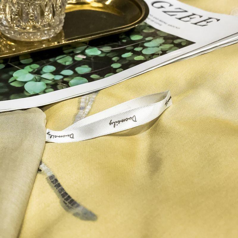 Close-up of Orquidea Amarilla Duvet Cover Set (Egyptian Cotton) with elegant design, part of a luxury bedding collection.