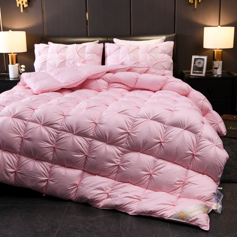 Luxurious pink Giuseppina 1000 Thread Count Goose Down Comforter Duvet on bedroom bed setting