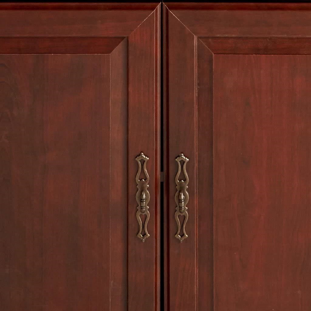 Close-up of doors on 71-inch High 3-Shelf Wooden Bookcase with Storage Drawer in Cherry Finish, featuring elegant handles and cherry wood finish.