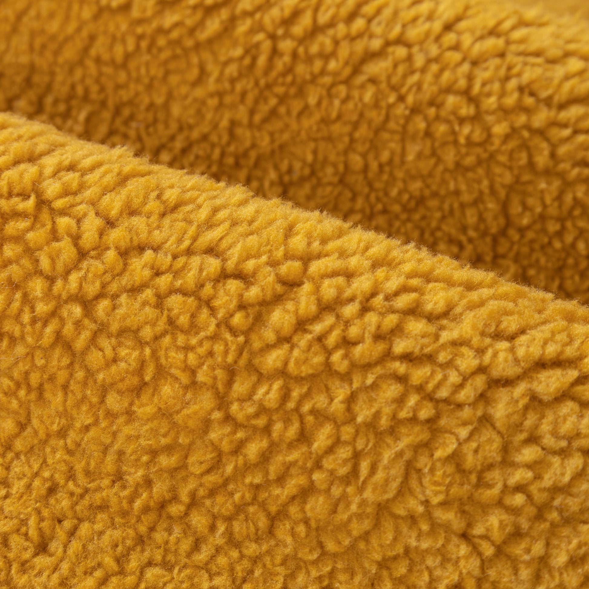 Close-up of Luxury Sherpa Fleece Solid Sofa Towels Thickened Plush Non Slip Sofa Cushion Covers in mustard yellow fabric.