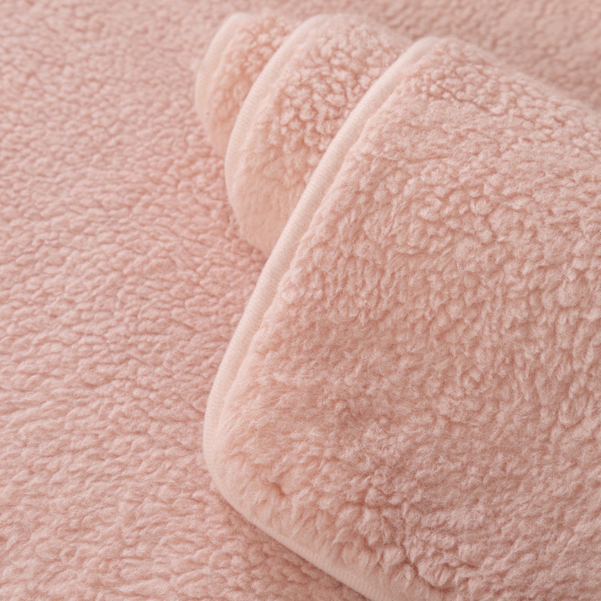Close-up of Luxury Sherpa Fleece Solid Sofa Towels Thickened Plush Non Slip Sofa Cushion Covers in soft pink color.