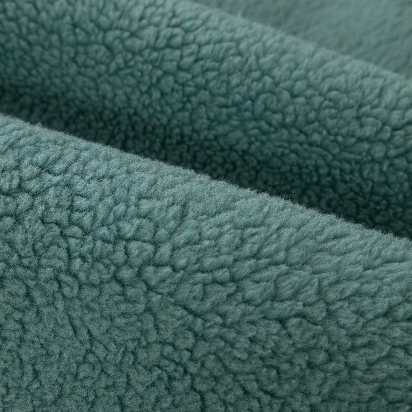 Close-up of green Luxury Sherpa Fleece Solid Sofa Towels Thickened Plush Non Slip Sofa Cushion Covers texture.