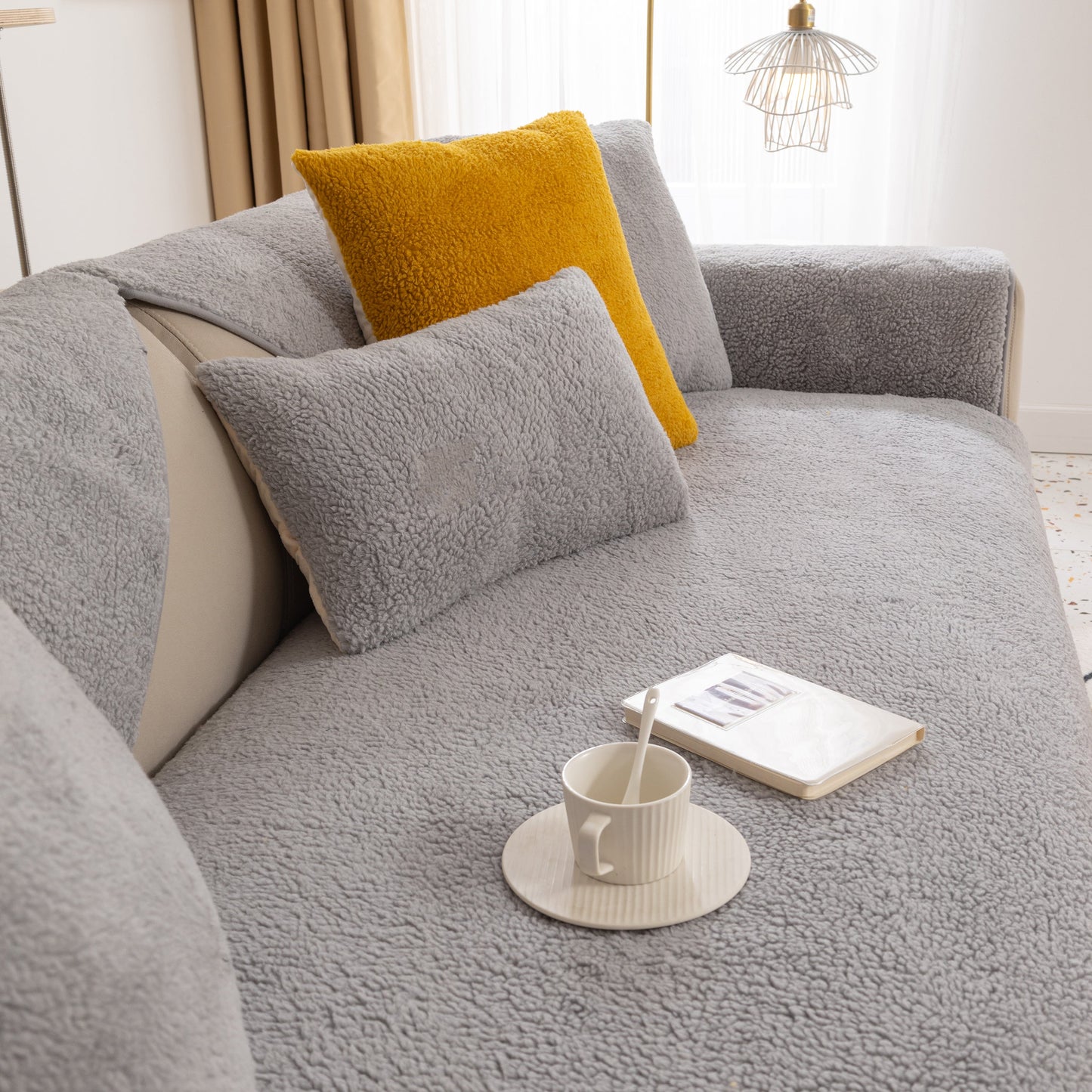 Luxury Sherpa Fleece Solid Sofa Towels Thickened Plush Non Slip Sofa Cushion Covers in a cozy living room setting with coffee cup and book.