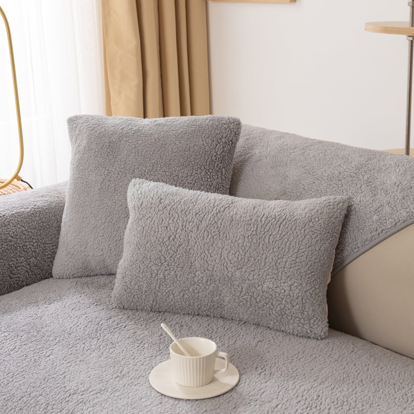Luxury Sherpa Fleece Solid Sofa Towels Thickened Plush Non Slip Sofa Cushion Covers on a couch with pillows and a coffee cup