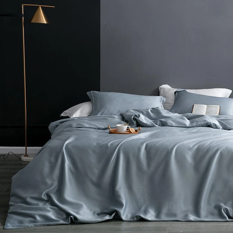 Karen Solid Color Lyocell Duvet Cover Set in modern boho style, made of soft Tencel lyocell, shown in a bedroom setting, blue color.