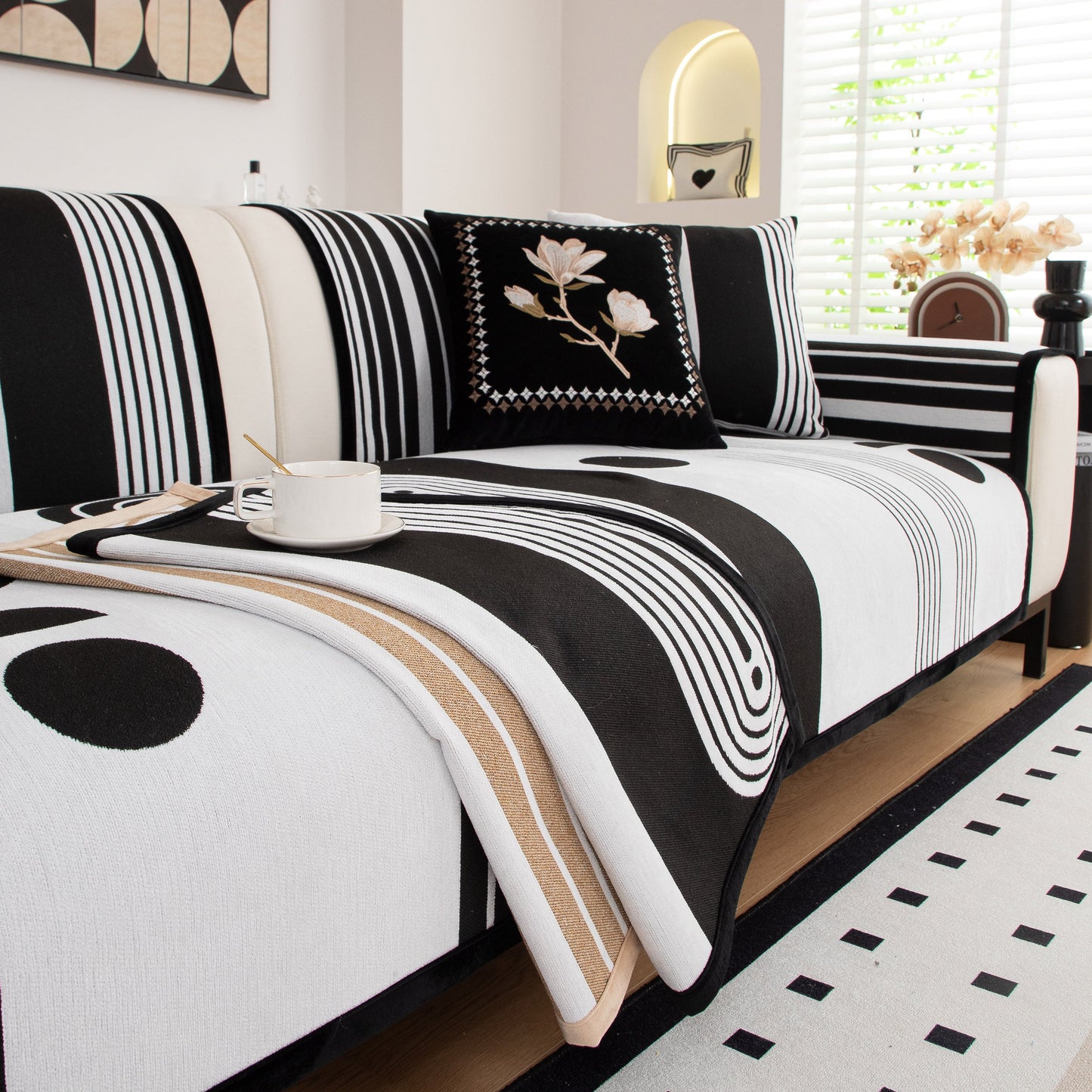 Modern Geometric Sofa Cover - Thick Woven, Pet Friendly, Stylish Couch Protector on a sofa with abstract black and white patterns.